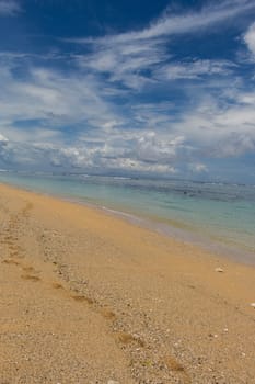 Beautiful secluded sandy beach in the Caribbean with white sand and blue sky as in paradise