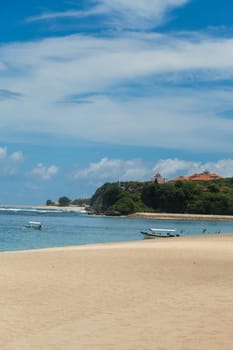Beautiful secluded sandy beach in the Caribbean with white sand and blue sky as in paradise