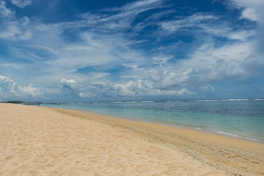 Beautiful secluded sandy beach in the Caribbean with white sand and blue sky as in paradise