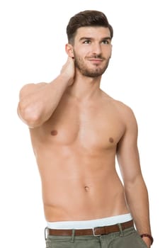 attractive muscular young man with free torso and beard isolated against white background
