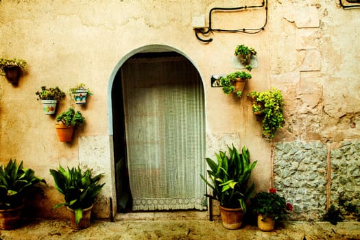Vintage photo of traditional house in mediterranean village Valldemossa Mallorca, Spain