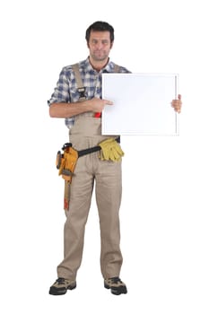 Handyman pointing to poster