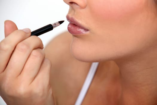 Woman applying make-up