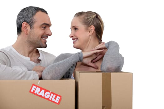 Couple stood with cardboard boxes