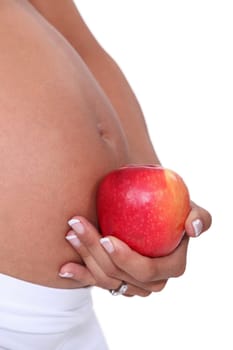 Pregnant woman holding apple