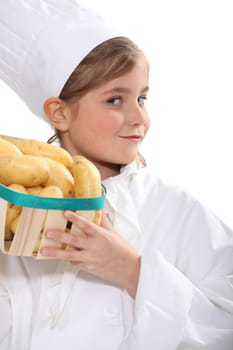 Girl with a crate of potatoes