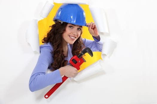 female worker watching us through a hole in a paper wall