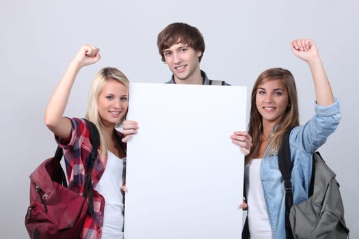 Three teenagers with backpacks