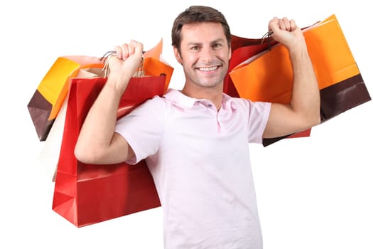 A man with plenty of shopping bags.