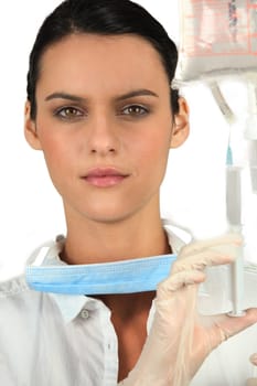 Nurse with drip and syringe