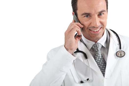 Doctor on phone smiling
