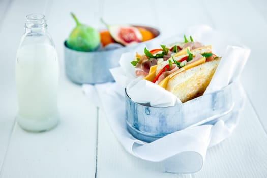 Tasty Sandwich with Fresh Milk and Fruits Served on White Wooden Table. Healthy Food for Day to Day.