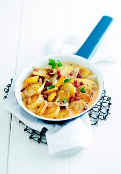 Ready to Eat Delicious Fried Potatoes in Pan Serve on White Table. Good Source for Carbohydrates
