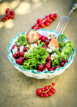 Appetizing Fresh Summer Salad in Bowl on Wooden Background. Good for Vegetarians.