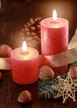 Lighted candles on decorated table - Christmas concept