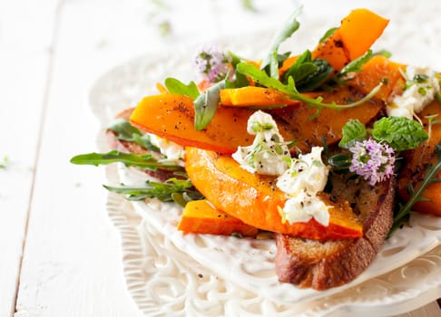 Macro Gourmet Hokkaido Pumpkin Salad Flowering Style on White Table.