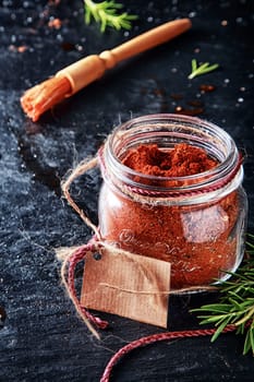 Macro Marinade Powder Container with Small Brush on Vintage Table. Used in Adding Meat Flavors.