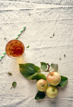 Three Fresh Apples and Glass on Off White Cloth. Used for Wellness Designs