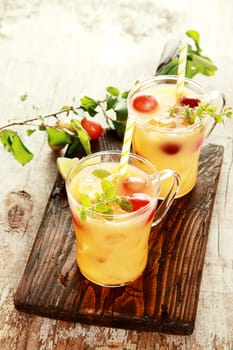 Two Healthy Delicious Fruit Juices on Wooden Table. Good for Detoxifying.