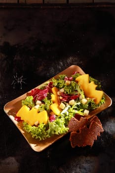 Bat Shaped Garnishes in Halloween Salad with Copyspace