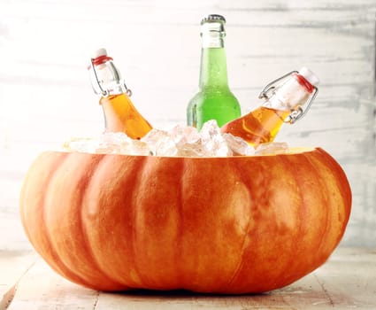 Bottled Alcoholic Beverages Chilling in Pumpkin Ice Bucket