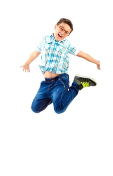 Happy little boy jumping on white background
