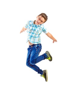 Happy little boy jumping on white background
