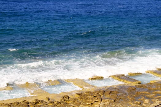 Rocky natural pools in the beach