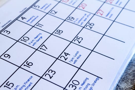 Checking monthly activities and appointments at the office.