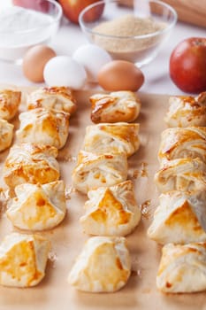 Delicious apple turnovers with baking ingredients for Thanksgiving