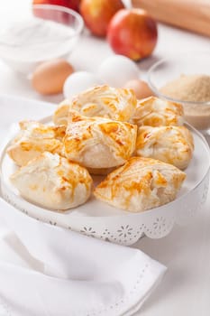 Delicious apple turnovers with baking ingredients for Thanksgiving