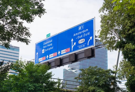 direction sign above highway in amsterdam, netherlands