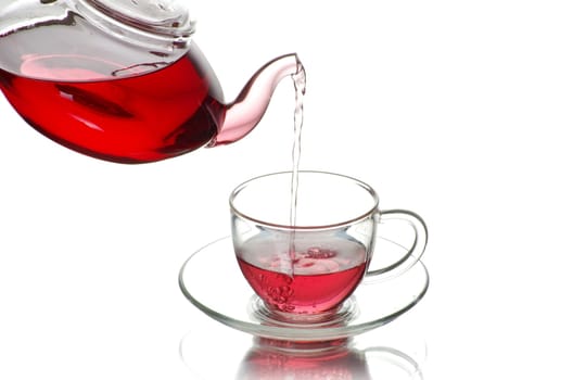 Tea being poured into glass tea cup