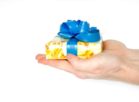 Gift in hands on a white background