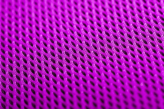 magenta background. Mesh fabric texture. Macro perspective