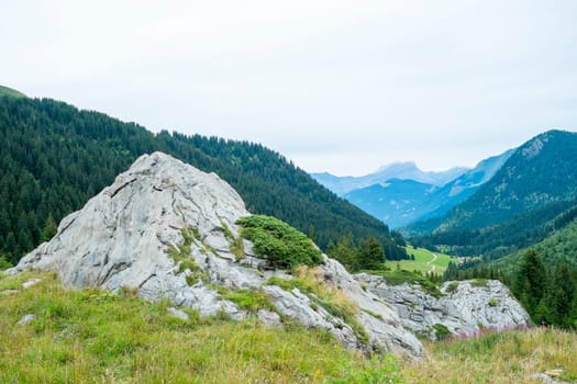 Bolder with La Rollaz valley in the background, one of the stages in the Mont Blanc Tour.