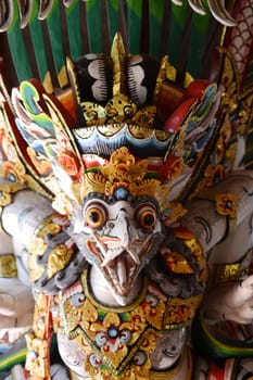 A close up shot of a Balinese statue
