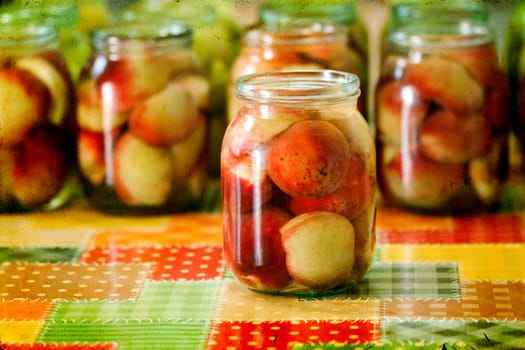 Jars of homemade fruit preserves - peach compote