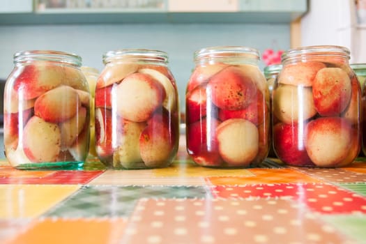 Jars of homemade fruit preserves - peach compote