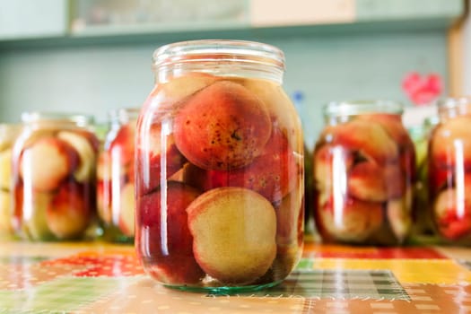 Jars of homemade fruit preserves - peach compote