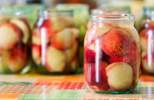 Jars of homemade fruit preserves - peach compote