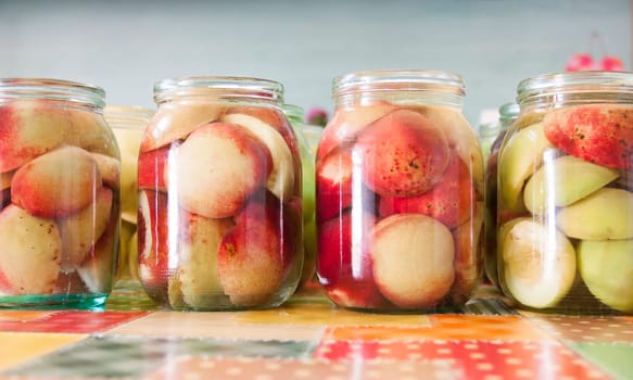 Jars of homemade fruit preserves - peach compote