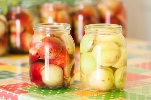 Jars of homemade fruit preserves - peach compote