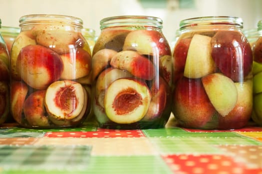 Jars of homemade fruit preserves - peach compote