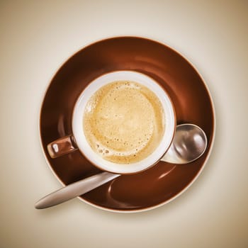 An image of a brown cup of coffee