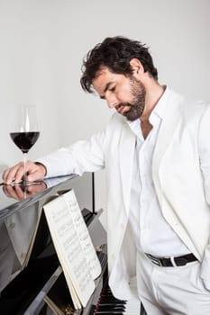 An image of a handsome man and a piano