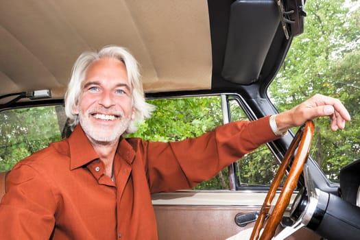 An image of a nice man in his car