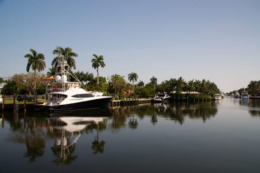 a yacht at a jetty next to a property in Fort Lauderdale