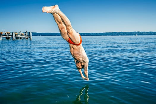 An image of a man jumping into the water