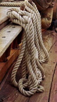Old yacht ropes around a cleat